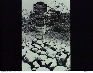 MILNE BAY, PAPUA, 1942. MEMORIAL COMMEMORATING THE MEN WHO DIED IN THE SUCCESSFUL DEFENCE OF TURNBULL FIELD. THE SPOT MARKS THE POSITION AT MILNE BAY WHERE THE JAPANESE FORCES MET THEIR FIRST ..