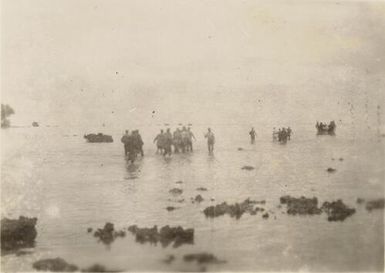 The carrying of the wounded to barge