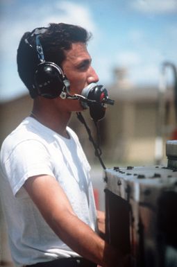 A Hawaii Air National Guard ground crewman prepares an aircraft for take off