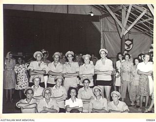 LAE, NEW GUINEA. 1945-11-08. THE FOOTBALL TEAM, WHO WERE JUDGED SECOND PRIZE WINNERS IN THE BEST GROUP, AT THE FANCY DRESS PARTY HELD BY MEMBERS OF AUSTRALIAN WOMEN'S ARMY SERVICE BARRACKS TO ..