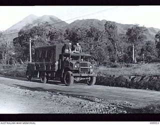 RABAUL, NEW BRITAIN, 1946-03-30. THE CREW OF UNIT NO 149, MOBILE CINEMA HQ, AUSTRALIAN ARMY AMENITIES SERVICE, MOVING OUT FROM CAMP FOR THEIR ALLOTTED FILM SITE. SIX OF THESE UNITS SERVICE THE AREA ..