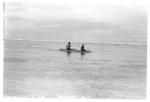 Small outrigger canoe with anthropologists? aboard