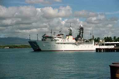 The ocean surveillance ship USNS TENACIOUS (T-AGOS-17), foreground, and USNS CONTENDER (T-AGOS-2) lie tied up at Bishop's Point.