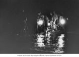 Researchers gather for a langusta hunt on Enewetak Island, August 9, 1964