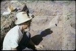 Vaiohu'a archaeological excavation, Moorea: worker in handwoven hat