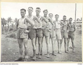 NAGADA, NEW GUINEA. 1944-07-26. A GROUP OF VICTORIAN AUSTRALIAN RULES FOOTBALL PLAYERS WHO PLAYED IN THE MATCH BETWEEN THE TEAMS FROM THE 29/46TH INFANTRY BATTALION AND THE 37/52ND INFANTRY ..