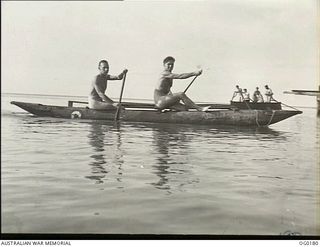 GOODENOUGH ISLAND, PAPUA NEW GUINEA. C. 1943-09. 121806 LEADING AIRCRAFTMAN W. W. BURGAN OF SEMAPHORE, SA AND 34653 SERGEANT E. MCDONALD OF BALMAIN, NSW, DRAUGHTSMEN, BOTH MEMBERS OF NO. 7 MOBILE ..