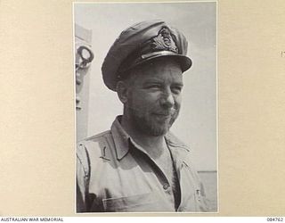 MIOS WUNDI, DUTCH NEW GUINEA. 1944-11-12. ENGINEER OFFICER C A QUERNS IN HARBOUR ABOARD HMAS STAWELL