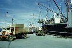 Loading plywood (made at Bulolo) overseas ship at Lae