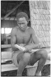 Man carving on a piece of wood