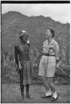 Anthropologist Denise O'Brien laughs with man wearing large kina shell jewelry