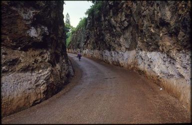 Person walking along road, Mangaia