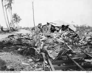 SALAMAUA, NEW GUINEA, 1943-09-26. JAPANESE INSTALLATIONS WHICH WERE WRECKED BY THE HEAVY ALLIED BOMBING ON KELA ROAD