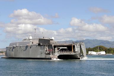 The US Navy (USN) experimental High Speed Vehicle 2 (HSV 2) Swift shifts berths at Pearl Harbor, Hawaii (HI), near the USS Arizona (BB 39) Memorial. The Swift is taking part in the multi-national maritime Exercise RIM OF THE PACIFIC 2004 (RIMPAC). RIMPAC is the largest international maritime exercise in the waters around the Hawaiian Islands. This years exercise includes seven participating nations: Australia, Canada, Chile, Japan, South Korea, United Kingdom and United States. RIMPAC is intended to enhance the tactical proficiency of participating units in a wide array of combined operations at sea, while enhancing stability in the Pacific Rim region