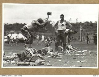 DONADABU, PAPUA, NEW GUINEA. 1944-01-01. THE WOOD CHOP IN PROGRESS DURING THE 15TH INFANTRY BRIGADE GYMKHANA. IDENTIFIED PERSONNEL ARE: PRIVATE L. J. ROHDE (1); PRIVATE S. R. TUDOR (2)