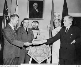 WASHINGTON, DC, USA. 1944-07-10. THE PRESENTATION OF A PLAQUE TO THE US NAVY FOR INSTALLATION IN THE CRUISER USS CANBERRA, WHICH WAS NAMED IN HONOUR OF THE AUSTRALIAN CRUISER SUNK AT THE BATTLE OF ..