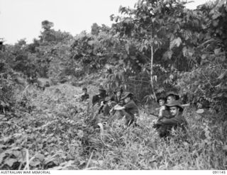 A FORWARD OBSERVATION PATROL FROM C COMPANY, 2/1ST INFANTRY BATTALION, RESTING AFTER STRIKING LEVEL GROUND ONCE MORE. IDENTIFIED PERSONNEL ARE:- WO 2 S.M. WILSON (1); SGT OMENANAM (2); PTE D.A. ..