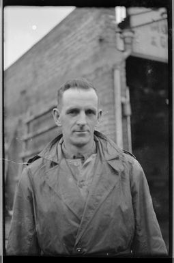 Man at premises of Coutts Bros and Hare Ltd, Willis St, Wellington