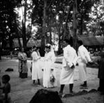 Wedding party waiting to be summoned to feast