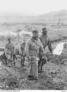 KESAWAI AREA, RAMU VALLEY, NEW GUINEA. 1943-12-18. VX1 GENERAL SIR THOMAS BLAMEY GBE KCB CMG DSO ED (1) COMMANDER-IN-CHIEF, ALLIED LAND FORCES, SOUTH WEST PACIFIC AREA AND PARTY CLIMBING A RIDGE ..