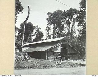 LAE, NEW GUINEA. 1944-09-27. ONE OF THE MANY STORE SHEDS OF THE 43RD FIELD ORDNANCE DEPOT