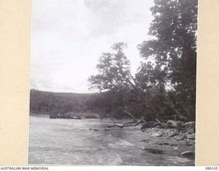 SATTELBERG, NEW GUINEA. 1944-07-06. THE COASTLINE NEAR THE SATTELBERG AREA. THE PHOTOGRAPH WAS TAKEN FOR USE BY VX76415 LIEUTENANT R.B. EWERS, OFFICIAL WAR ARTIST, MILITARY HISTORY SECTION