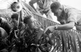 Malaysia, military man talking to ceremonial perfumer with Republic of Fiji Military Forces camp