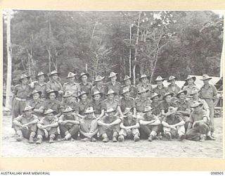 Group portrait of members of 17 Platoon, D Company, 7th Battalion. Identified, left to right, back row: R G Moody; W B Hooper; W McEniry; T F Green; D S Kelly; M T Ellis; J P McNally; D J Davern; M ..