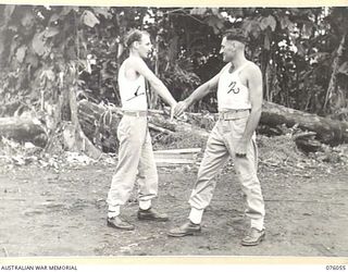 LAE, NEW GUINEA. 1944-09-21. CORPORAL J.L. LEYS (1) AND SERGEANT A.J. DENSMORE (2) OF THE NEW GUINEA FORCE PROVOST COMPANY PRACTICING UNARMED COMBAT