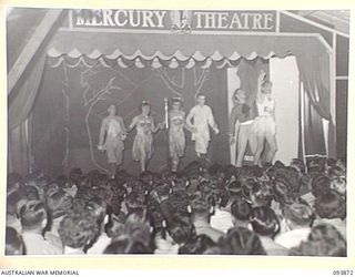LAE AREA, NEW GUINEA, 1945-07-09. THE MALE BALLET ACT DURING THE REVUE "OVER TO YOU" STAGED BY 19 LINES OF COMMUNICATION AREA SIGNALS. IT WAS HELD IN THE UNIT'S RECREATION HUT WHICH WAS KNOWN FOR ..