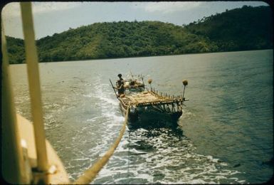 Canoe in Sewa Bay, requested a tow : Normanby Island, D'Entrecasteaux Islands, Papua New Guinea, 1956-1959 / Terence and Margaret Spencer