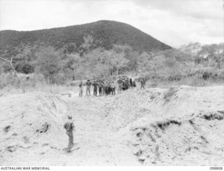 VULCAN, RABAUL AREA, NEW BRITAIN. 1945-11-14. THE CRATER FORMED BY THE DESTRUCTION OF APPROXIMATELY 20 TONS OF JAPANESE AMMUNITION. IT WAS DESTROYED BY MEMBERS OF HEADQUARTERS 11 DIVISION