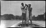 Two men holding a kingfish caught by Lambert