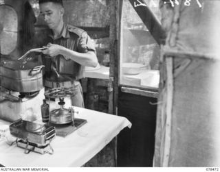 TAGESSI, BOUGAINVILLE ISLAND. 1945-01-17. Q48277 PRIVATE G.W. COOPER, THEATRE ASSISTANT OF THE MEDICAL DRESSING STATION, 7TH FIELD AMBULANCE STERILISING INSTRUMENTS IN THE OPERATING THEATRE