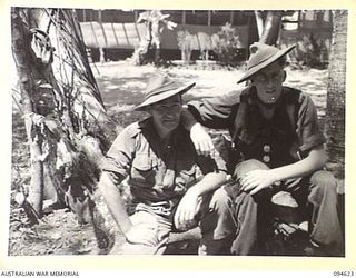 LAMARIEN, HENRY REID BAY, NEW BRITAIN, 1945-07-28. TROOPER J. GRIFFIN (1) AND LANCE-CORPORAL F. O'NEILL (2), MEMBERS OF 2/2 COMMANDO SQUADRON. LANCE-CORPORAL O'NEILL WAS IN TIMOR AND NEW GUINEA AND ..