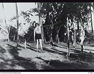 MADANG, NEW GUINEA. 1944-06-15. SENIOR OFFICERS OF HEADQUARTERS 15TH INFANTRY BRIGADE ENJOYING A GAME WITH SQUASH RACQUETS AT SIAR PLANTATION. LEFT TO RIGHT: VX24325 BRIGADIER H. H. HAMMER DSO, ..