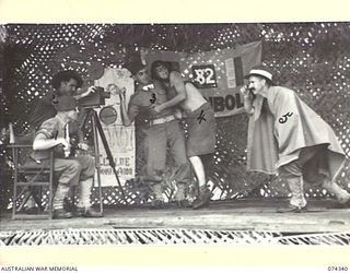 SIAR, NEW GUINEA. 1944-06-25. THE HOLLYWOOD VILLAIN APPEARS ON THE STAGE DURING THE FILMING OF A LOVE SCENE DURING A CONCERT STAGED AT THE UNIT THEATRE BY MEMBERS OF THE 57/60TH INFANTRY BATTALION ..