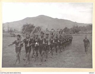 RABAUL, NEW BRITAIN, 1945-11-25. MEMBERS OF THE ROYAL PAPUAN CONSTABULARY MARCHING DURING A PARADE AT THEIR HEADQUARTERS