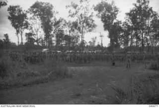 Sogeri, New Guinea. 1942-10-04. Lieutenant Colonel Albert Caro, Commanding Officer of 2/16th Battalion, 21st Australian Infantry Brigade, addressing his troops before a review of the Brigade by ..