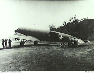 PORT MORESBY, PAPUA, 1942-11-03. THE 5TH AIR FORCE (USAAF) C47 TRANSPORT AIRCRAFT "IRENE" AFTER LANDING AT WARDS STRIP AFTER COMPLETING A SUPPLY DROPPING MISSION TO KOKODA. DURING A RUN OVER KOKODA ..