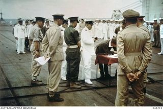 Lieutenant General Hitoshi Imamura, Commander of the Japanese 8th Area Army, signing the instrument of surrender on board  HMS Glory near Rabaul. Vice AdmiraI Jinichi Kusaka, Commander of the ..