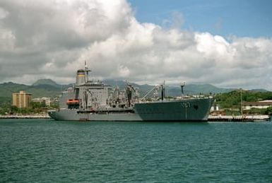 The fleet oiler USNS PECOS (T-AO-197) lies tie up at the pier.