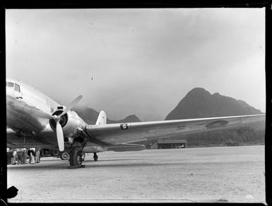 View of a C47 Dakota transport plane with unidentified USAAF personnel, Tafuna Airfield, American Samoa