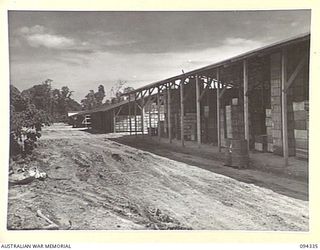 TOROKINA, BOUGAINVILLE. 1945-07-25. THE STORAGE SHEDS AT NO. 2 SUB DEPOT, 16 ADVANCED ORDNANCE DEPOT