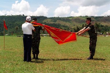 Veterans of the 9th Marine Regiment, assist in the Rededication of the Regimental Battle Streamers, during the 50TH Anniversary Ceremony for the Liberation of Guam in WWII