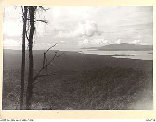 WEWAK AREA, NEW GUINEA, 1945-07-14. A SECTION OF THE PANORAMIC VIEW FROM MOUNT SHIBURANGU (1648 FT) AFTER ITS CAPTURE BY 2/8 INFANTRY BATTALION TROOPS. IT SHOWS CAPE WOM AT THE RIGHT SWEEPING TO ..