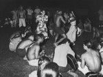 Marquesans at the village of Taiohae perform "Nuku Hiva" dance, with scientific crew from the Capricorn Expedition as audience