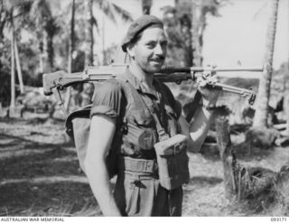 MOROKAIMORO, BOUGAINVILLE, 1945-06-12. TPR B. CAMPBELL, A TROOP, 2/8 COMMANDO SQUADRON, BEARDED AND WEARY ON ARRIVAL AT SQUADRON HEADQUARTERS AFTER AN EIGHT DAY PATROL INTO JAPANESE HELD TERRITORY