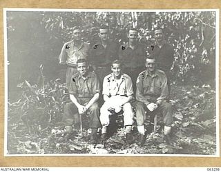 WALINGAI BEACH, NEW GUINEA. 1944-01-04. MEMBERS OF THE 9TH DIVISION FIELD CASH OFFICE. THEY ARE: QX8113 WARRANT OFFICER CLASS 1 W. J. BRANSCOMBE (1); VX4620 CAPTAIN A. J. ANGUS (2); VX10679 STAFF ..