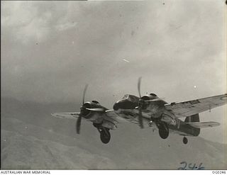 VIVIGANI, GOODENOUGH ISLAND, PAPUA. C. 1943. BEAUFIGHTER AIRCRAFT OF NO. 30 SQUADRON RAAF IN FLIGHT. MANY OF THESE FIGHTER AIRCRAFT ARE IN THE NEWS EVERY DAY IN THE SOUTH-WEST PACIFIC AREA